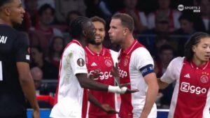 Read more about the article Jordan Henderson squares up to Ajax teammate Bertrand Traore before giving X-rated view of ex-Chelsea star during Europa League clash