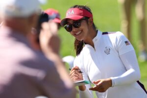 Read more about the article Watch: Caddies pull shirts off in fairway after Alison Lee holes out at Solheim Cup