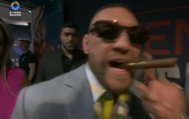 You are currently viewing Conor McGregor holds cigar in star-studded ringside seat next to Terence Crawford and Tyson Fury as he reveals reason for flying in for Anthony Joshua vs Daniel Dubois fight