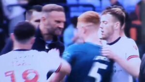 Read more about the article League One boss shown red card for squaring up to rival player in heated face-off following four-goal thriller