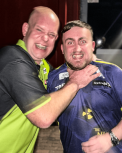 Read more about the article Luke Littler jokingly choked by Michael van Gerwen before being left ‘disgusted’ by record-breaking run ending