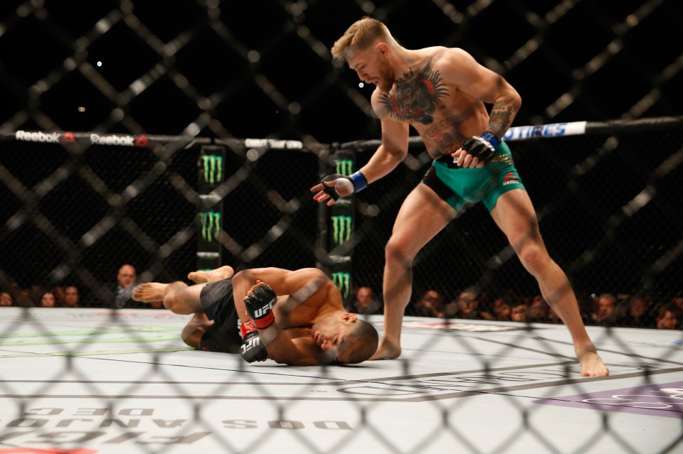 You are currently viewing Conor McGregor drops bad guy act to comfort Jose Aldo after 13-second KO in heartwarming footage from UFC 194