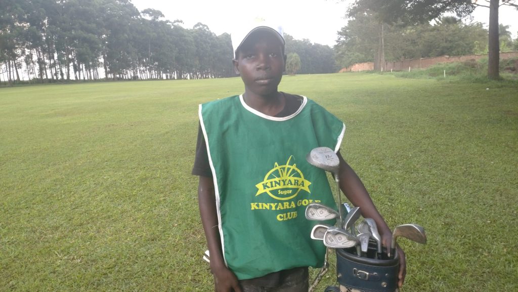 Read more about the article Elvis Obote: Kinyara Golf Club young caddie dreams of playing professional golf