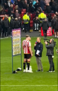 Read more about the article Fans in stitches as Sheffield United star forced to stand on stool next to teammate for interview