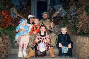 Read more about the article Conor McGregor knocks on London doors in camouflage with Dee Devlin and kids in Halloween fun