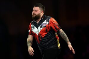 Read more about the article Michael Smith crashes out of World Championship and faces £500,000 problem