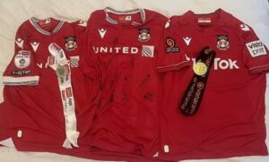 Read more about the article Wrexham star’s promotion medals and shirts listed on eBay for £100k