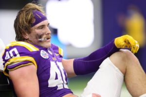 Read more about the article Gruesome video show LSU star’s twisted ankle being snapped back into place on field in front of horrified parents and brother