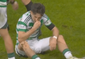 Read more about the article Celtic star Nicolas Kuhn left bloodied in chaotic first half of Old Firm derby as manager is forced to intervene