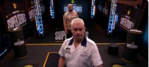 Read more about the article Darts match briefly halted as former world no.1 stumbles off stage in comical scenes