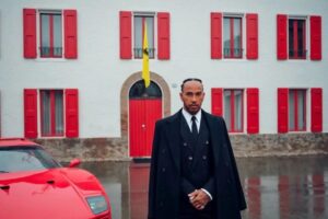 Read more about the article Lewis Hamilton’s Ferrari launch oozed class but style icon once awkwardly stumbled onto stage from zipwire