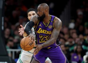 Read more about the article ‘Jordan would never’ – LeBron’s ‘shameless’ antics with Jayson Tatum slammed before Lakers star exits game with worrying injury