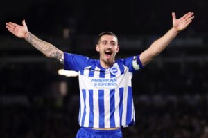 Read more about the article Lewis Dunk pokes fun at fickle Brighton fans with sign about his own manager at darts event