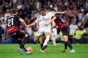 Read more about the article Kylian Mbappe makes Real Madrid history as Barcelona made to wait for title celebrations