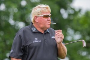 Read more about the article Two packs of cigarettes and four chocolate bars – John Daly shot opening round 82 in style at PGA Championship